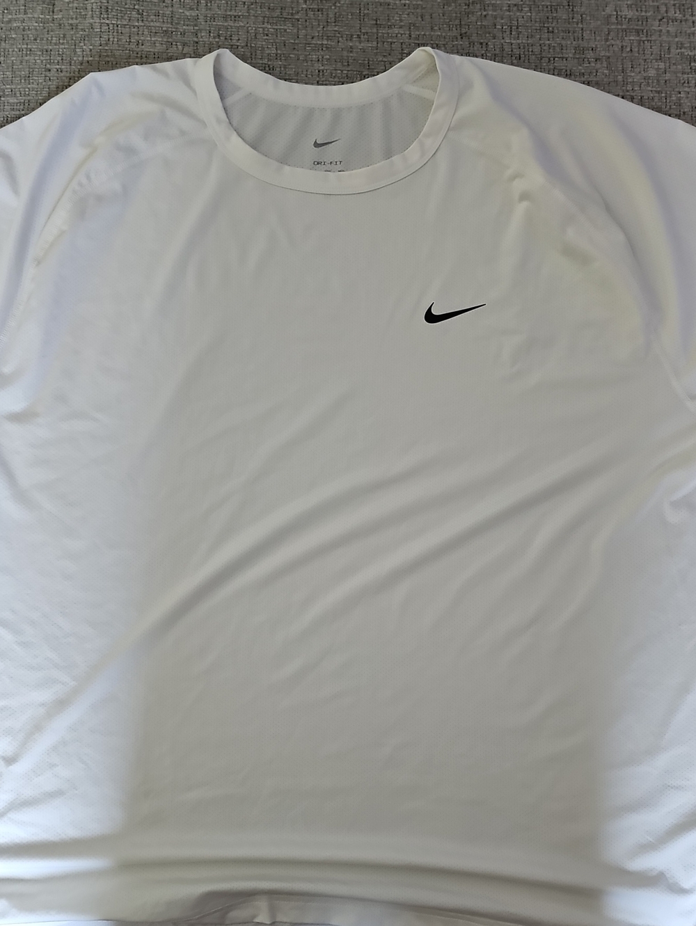 Nike White Short Sleeve Dri-FIT Tee with Black Swoosh